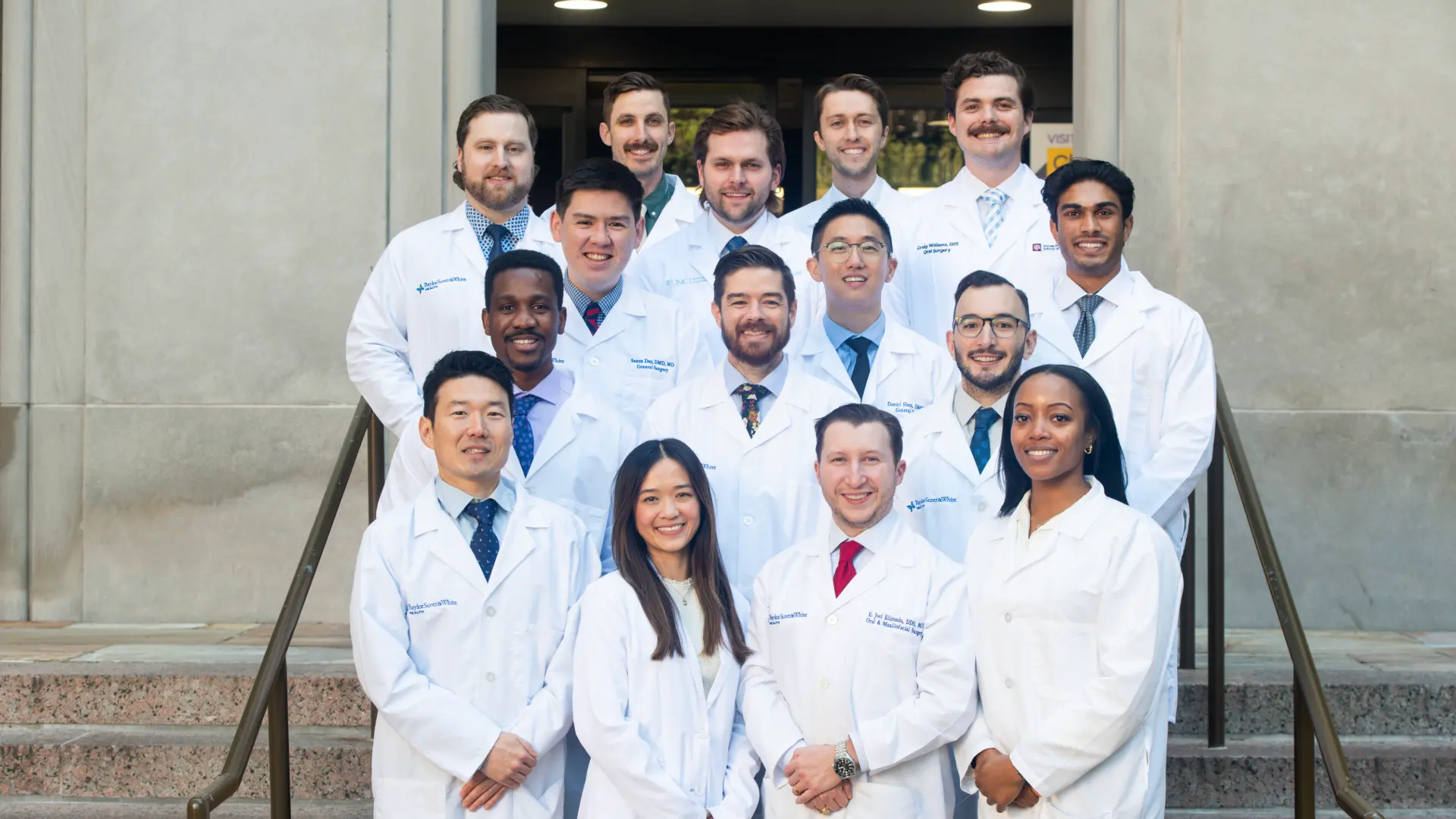 Group photo of Texas A&M Oral Surgeons in white lab coats.