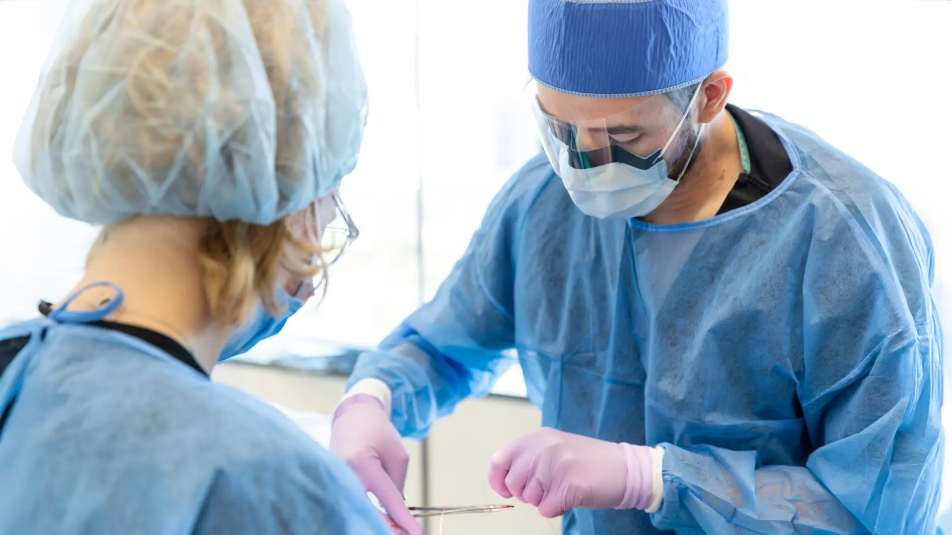 Texas A&M Dentistry Oral Surgeon and surgical assistant with a patient.
