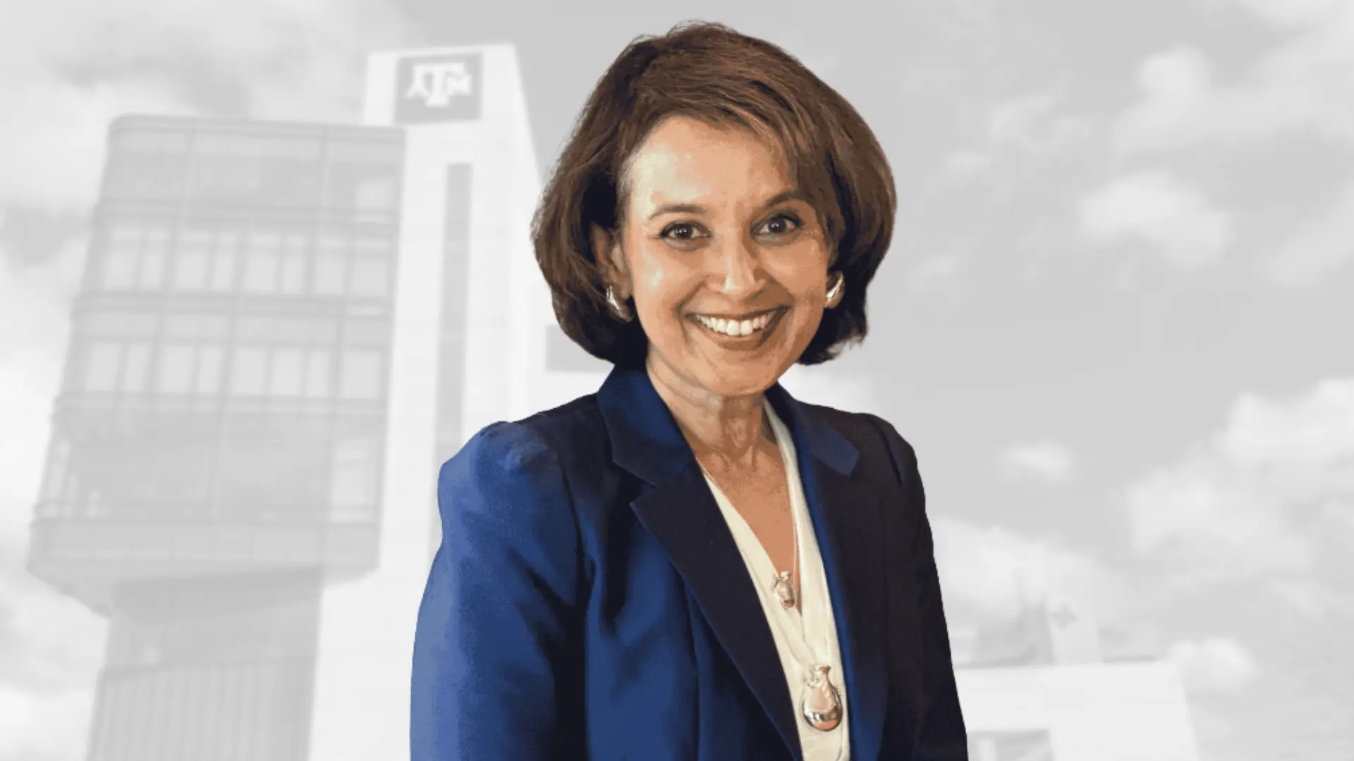 Photo of Dr. Purnima Kumar on a background featuring the Texas A&M Dentistry Clinic Building.